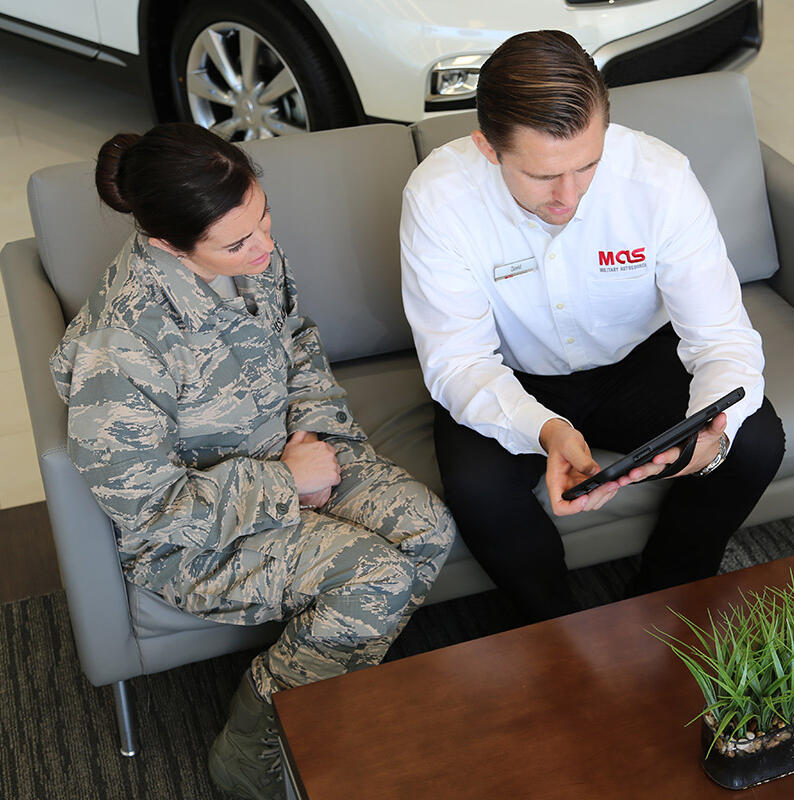 Military Autosource staff helping a customer